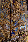 Bangkok Grand Palace,  Wat Phra Keow (temple of the Emerald Buddha). Detail of the decorations of the external walls of the ubosot. 